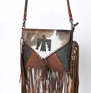Genuine hand tooled leather & cowhide envelope style fringe crossbody bag with tooled bird design