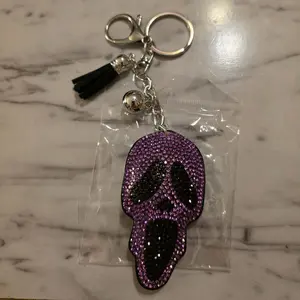 Purple Skull Keychain with Black Tassel and Silver Bell