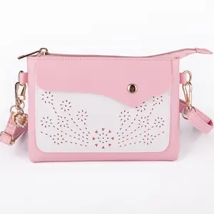 Mini crossbody bag for girls aged 8–14; cute laser-cut small purse handbag with wrist strap for kids, teens, and tweens; pink crossbody purse; small cell phone wallet clutch for school and shopping