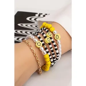 6 beaded bracelets set with polymer smiley face