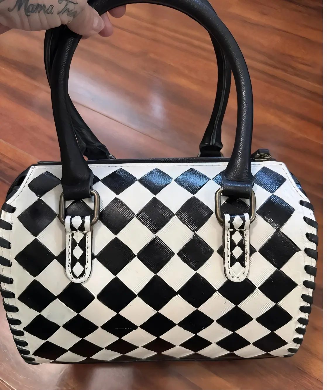 Elegant Black and White Checkered Handbag with Black Handles and silver Buckles