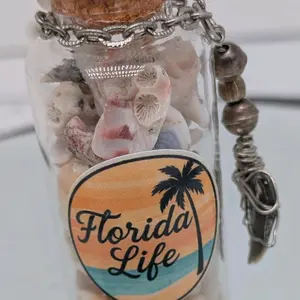 Handcrafted genuine authentic one of a kind Florida Before Us shell filled trinket bottle ornament featuring a shark tooth wire wrapped pendant by ToothRaiders