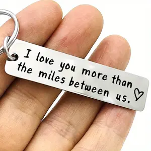 1pc stainless steel keyring, a long-distance relationship keyring for couples, a gift for your boyfriend or girlfriend featuring the message "I love you more than the distance between us", perfect for anniversaries or Valentine's Day.