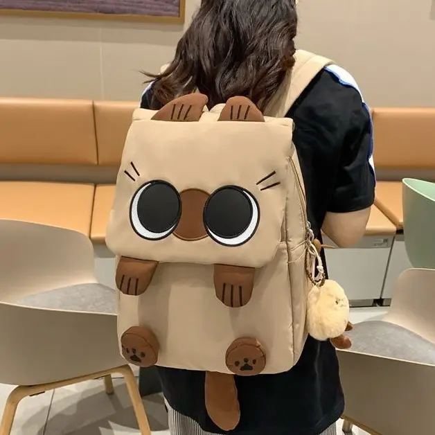 New Korean-style lightweight, high-capacity student backpack featuring a "so-ugly-it's-cute" cat design.