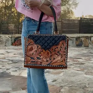 tooled leather with a quilted leather hand bag