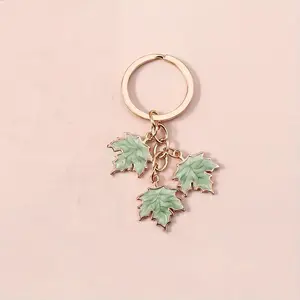 1pc Green Maple Leaf Zinc Alloy Dripping Oil Keychain - Gold-Colored Charm Keychain, Elegant Car Key Pendant, Fashion Accessory, Versatile Gift for Girlfriend, Detailed Craftsmanship, Gold-Colored Charm Keychains
