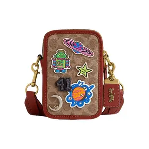 COACH x Mint x Serf Rogue 12 Mini Crossbody Bag with Canvas and Leather, Dual Zippers, and Hardware Clasp for Men in Tan and Rust