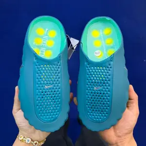 Solid Teal Blue Integrated Soft EVA Foam Slip On Clogs Forefoot Full Dot Perforated Breathable Patch Segmented Wavy Contour Body Light Green Insole With Yellow Round Cushion Pads Waterproof Casual Slides For Gym Pool Beach Shower