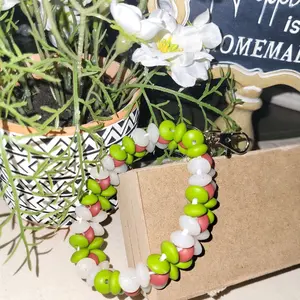 Green and Clear Wristlet Keychain Accessory with Colorful Beads and Floral Design
