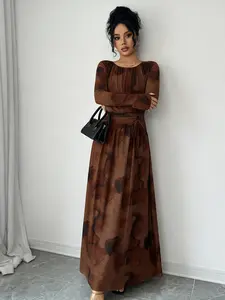 A women's brown fashionable casual ink wash pleated dress with pleated elements adding layers, long sleeved design for sun protection, suitable for commuting to work, shopping and outdoor activities, indoor and outdoor dressing