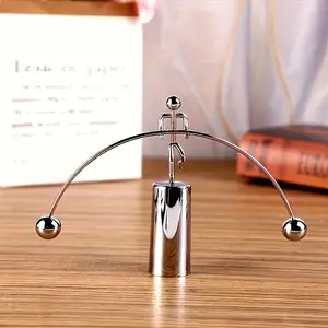 A Creative Newton Physics Ornament Featuring a Metal Iron That Spins on One Foot, Balanced with a Durable Plastic Base, Requires No Electricity, Making It a Great Stress-Relief Decoration for Home Or Office Desks, Perfect As a Holiday Gift