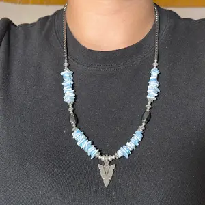 Navajo handmade Arrowhead Pendant Necklace with Hematite, dyed clam shells, silver hogan beads, and silver daisy beads.