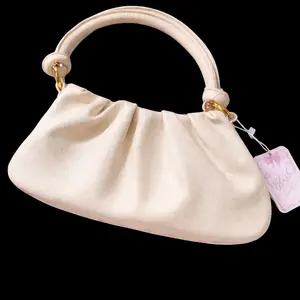 Elegant Cream Handbag with Gold Hardware and Soft Texture for Everyday Use