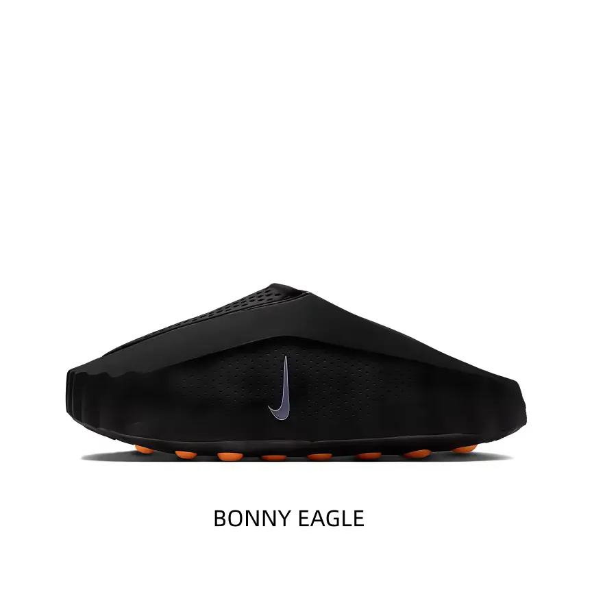 Minimalist Black Slip-On Footwear with Sculpted Sole Pattern and Subtle Branding for Urban & Athletic Wear