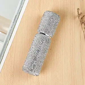 Diamond-studded perfume travel bottle