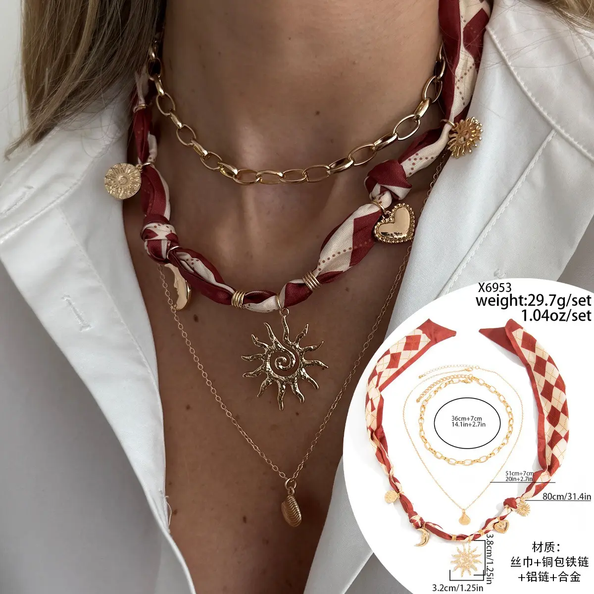 Coastal-style starfish and conch pendant necklace; a creative layered accessory featuring a silk scarf element, designed to sit at the collarbone.