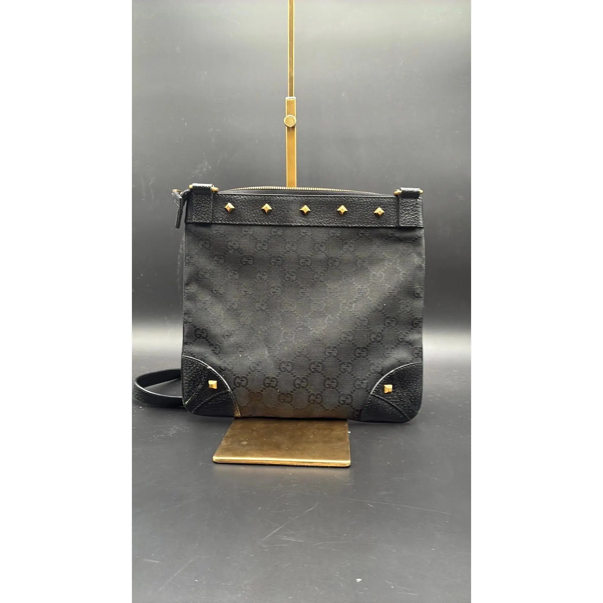 Pre-owned GUCCI Leather Luxury Bags & Accessories GG Canvas Nailhead/Studded Flat Messenger Bag, Black Date Code: 120893213048. Entrupy ID: HKT2GH7.