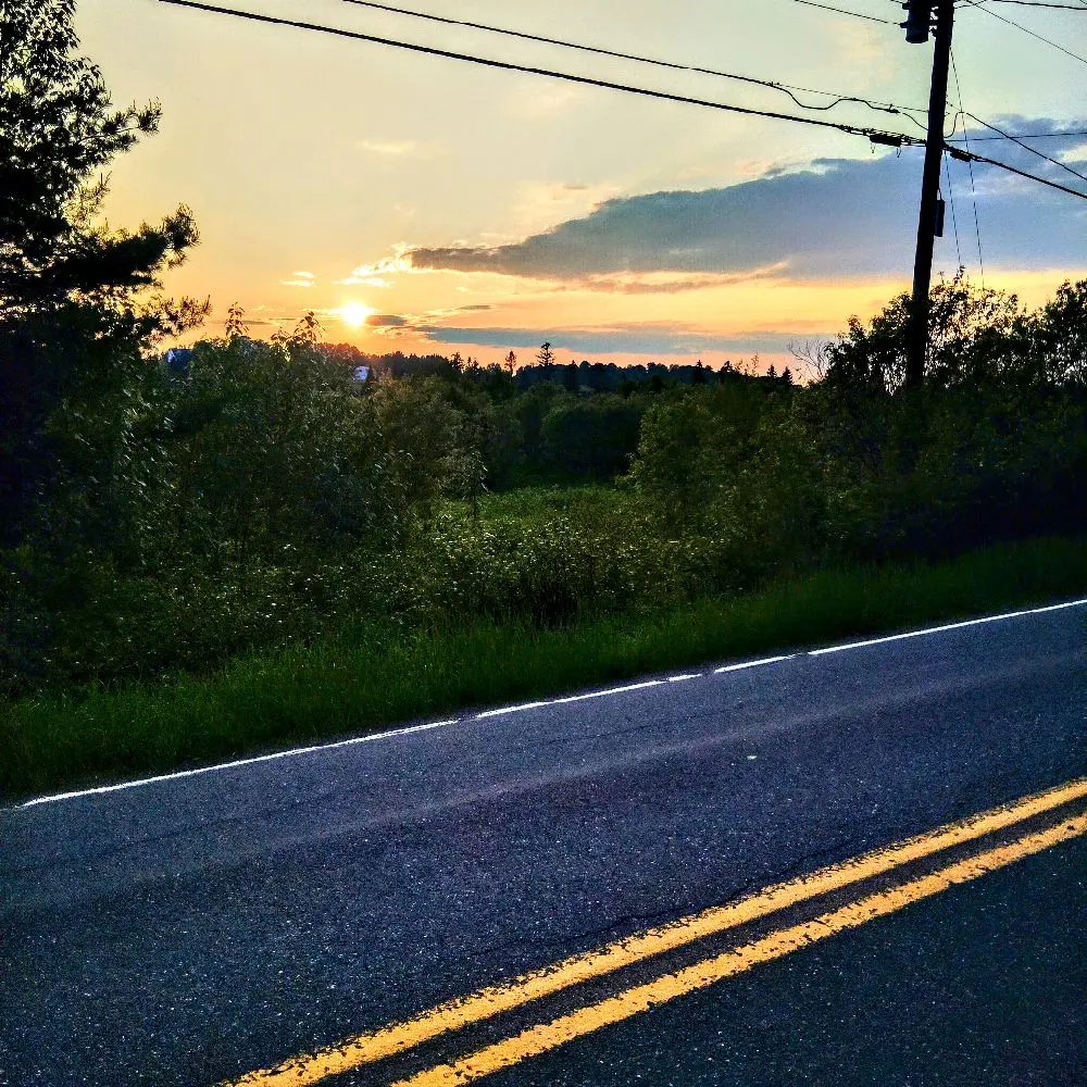 LW Photography's Whispers Before the Storm Collection - Serene Sunset Over Rural Road Scene Image