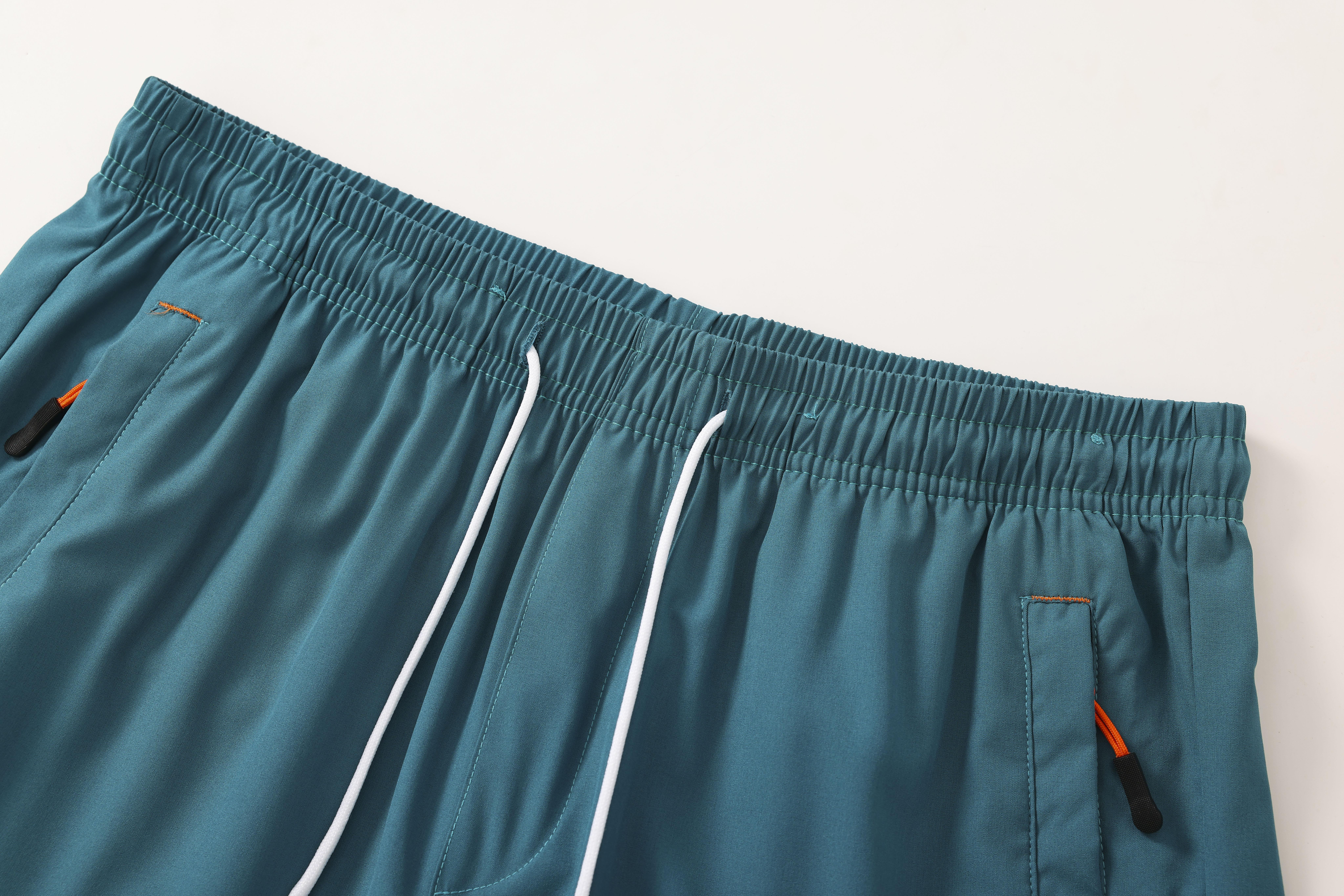 Men’s solid-color  with zippered pockets and drawstring; men’s everyday bottoms; sports- elastic-waist pocket shorts; spring/summer shorts—an ideal choice for daily  wear and athletic outfits. men's shorts Casual Breathable Quick-Dry