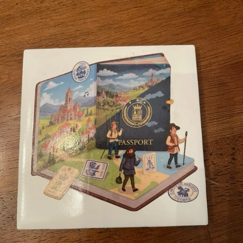 Start of the Camino Coasters - Passport Design with Travelers and Scenic Illustrations