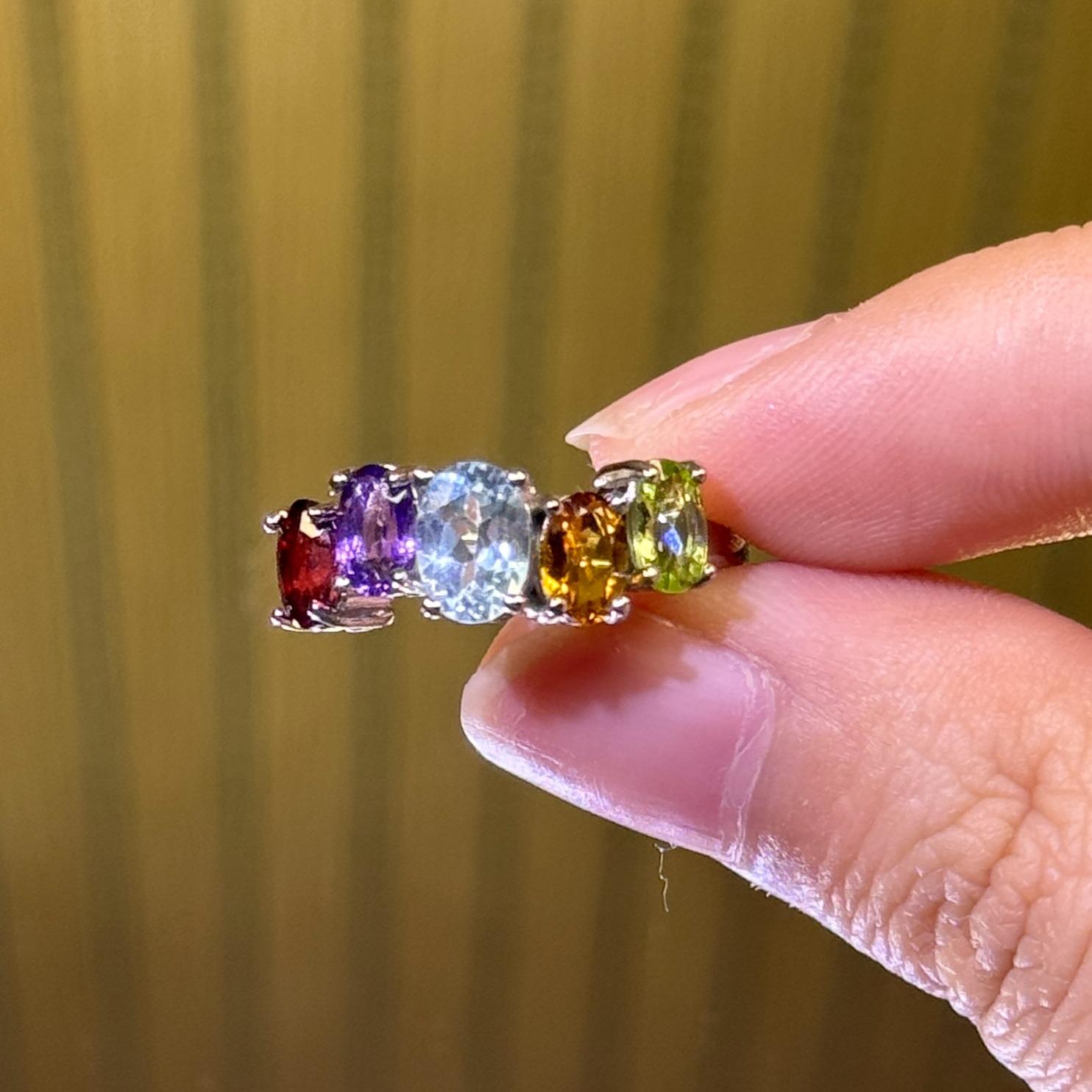 Titanium steel rings featuring natural blue sapphire, amethyst, citrine, olive stone, and pomegranate stone—oval, fashionable, and refined jewelry.