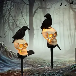 2pcs Glowing Skull Pathway Lights Solar Halloween Skull Stake Lights Decorations Outdoor Halloween Solar Pathway Lights Waterproof Resin Skeleton Crows Decor For Outside Yard Garden Lawn