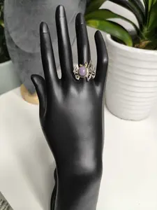 Mira(11305)gc.A two-tone metal crab-style ring set with an oval cabochon natural amethyst