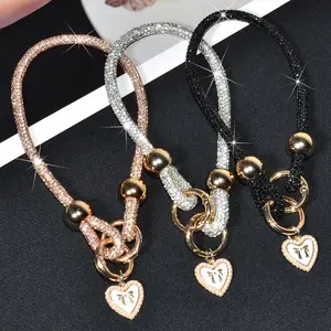 1Pc Luxury Sparkling Rhinestone Gold Beads Mobile Phone Lanyard, Featuring Bowknot And Heart-Shaped Pendant Wristband, Short Detachable Double-Buckle Phone Case Chain, Outdoor Travel Shopping Phone Anti-Lost Handheld Lanyard, Cellphone Accessories
