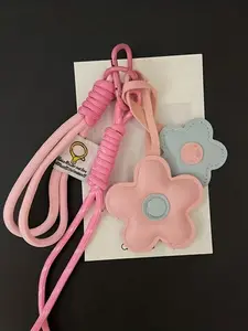 Pu Leather Small Flower+Knot Hanging Rope, Available In Black And White/Pink Blue Dual Colors. The Small Flower Shape Is Gentle And Healing, Suitable For Hanging Keys And Backpacks, Enhancing The Atmosphere With Daily Matching. Keychain For Bags