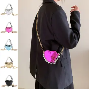 Mini heart-shaped handbag with pearl embellishments, cute lipstick pouch with chain strap, bright candy-colored shoulder bag for women, adorable.