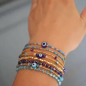 Evil Eye Bracelet Stack Beaded Jewelry with Blue and Gold Beads Waterproof Fashion Accessory