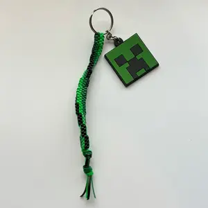 Creepin' Cool Rexlace Keychain with Green and Black Braided Rope and Pixelated Design