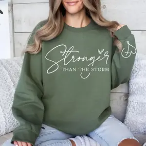 A sports shirt stronger than a storm - Women's inspirational Christian round neck sweater, Bible scripture positive affirmation sports shirt, a gift based on faithRAIMENTRY