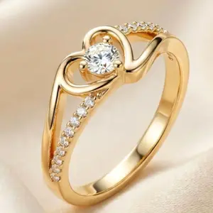 An elegant, sparkling 14k gold-plated heart-shaped ring adorned with Cubic Zirconia stones, perfect as a wedding, engagement, or Valentine's Day gift.