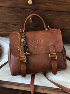 Niche classic fashion postman retro backpack, metal buckle design decorated with bell key personality pendant, embossed letter personality shape, retro literary handbag suitable for daily commuting, shopping, etc., Durable Backpack