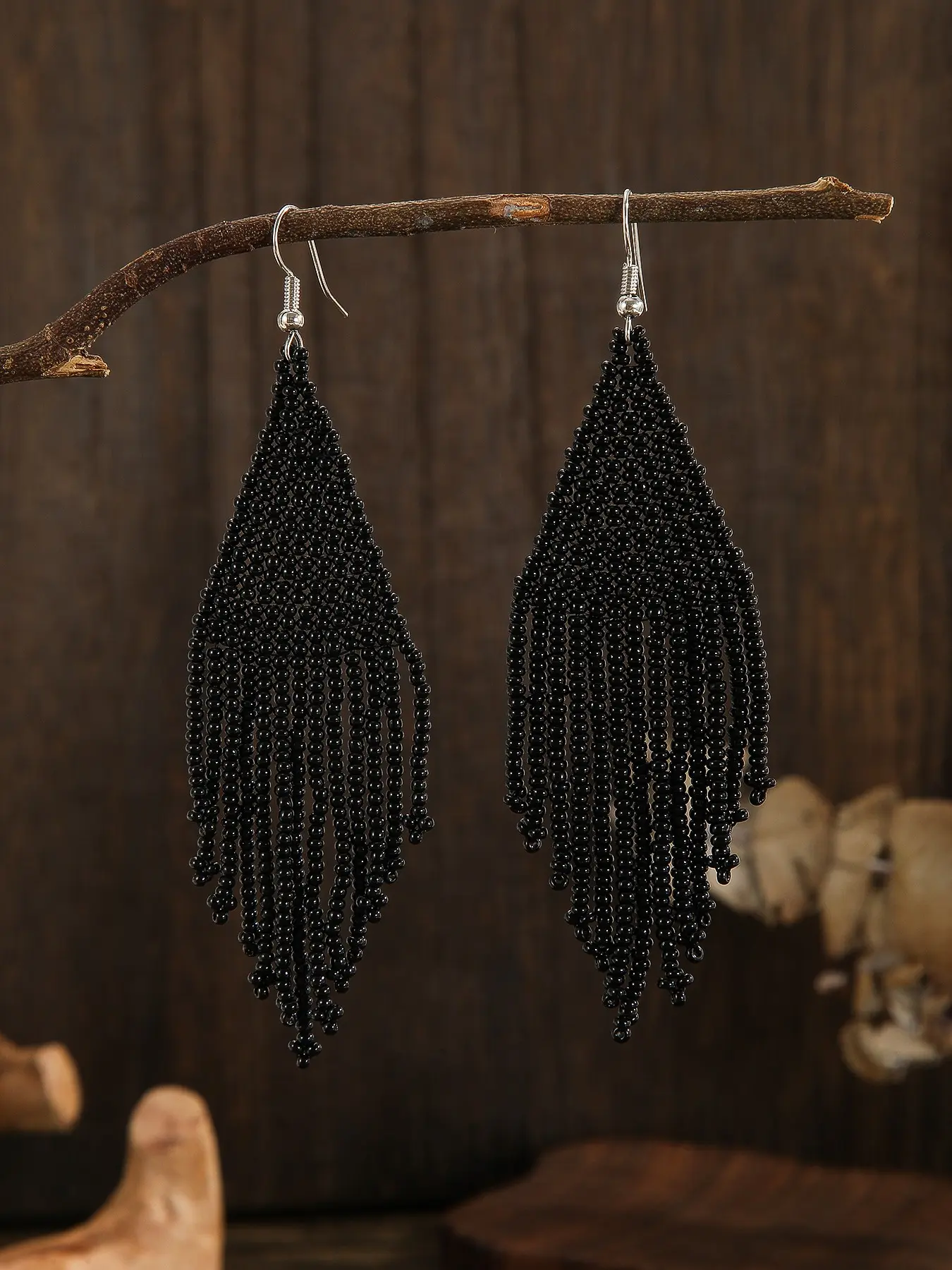 Elegant and fashionable Beaded earrings for ladies. Pure black tassel design. Bohemian retro style. Glass string beads hand-woven earrings. Jewelry Design. Ideal gifts for holidays or for daily use during vacations. Dangle Earrings