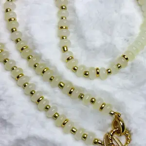 Pastel White Beaded Necklace with Gold Hints and Talisman Charm Vibrant Combination for Stylish Outfits