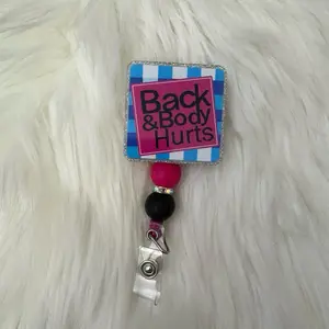 Back and body hurts badge reel