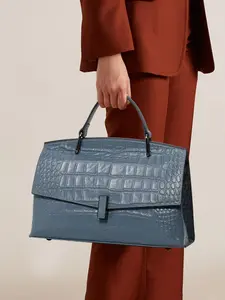 A blue handbag made of exquisite and fashionable cowhide material, with a shoulder strap suitable for commuting to work and traveling, Leather Handbag
