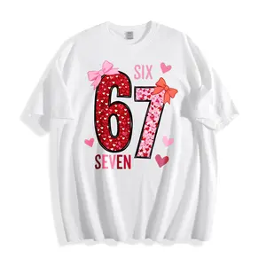 Cute And Playful Unisex T-Shirt With Pink Hearts And Bow Design Featuring The Number 67 And Words Six Seven Perfect For Spring And Summer Wear Ideal Gift For Friends Or Family Celebrating A Special Occasion