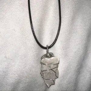 Clear Quartz from geode necklace set in silver wire with complementary black leather chain.