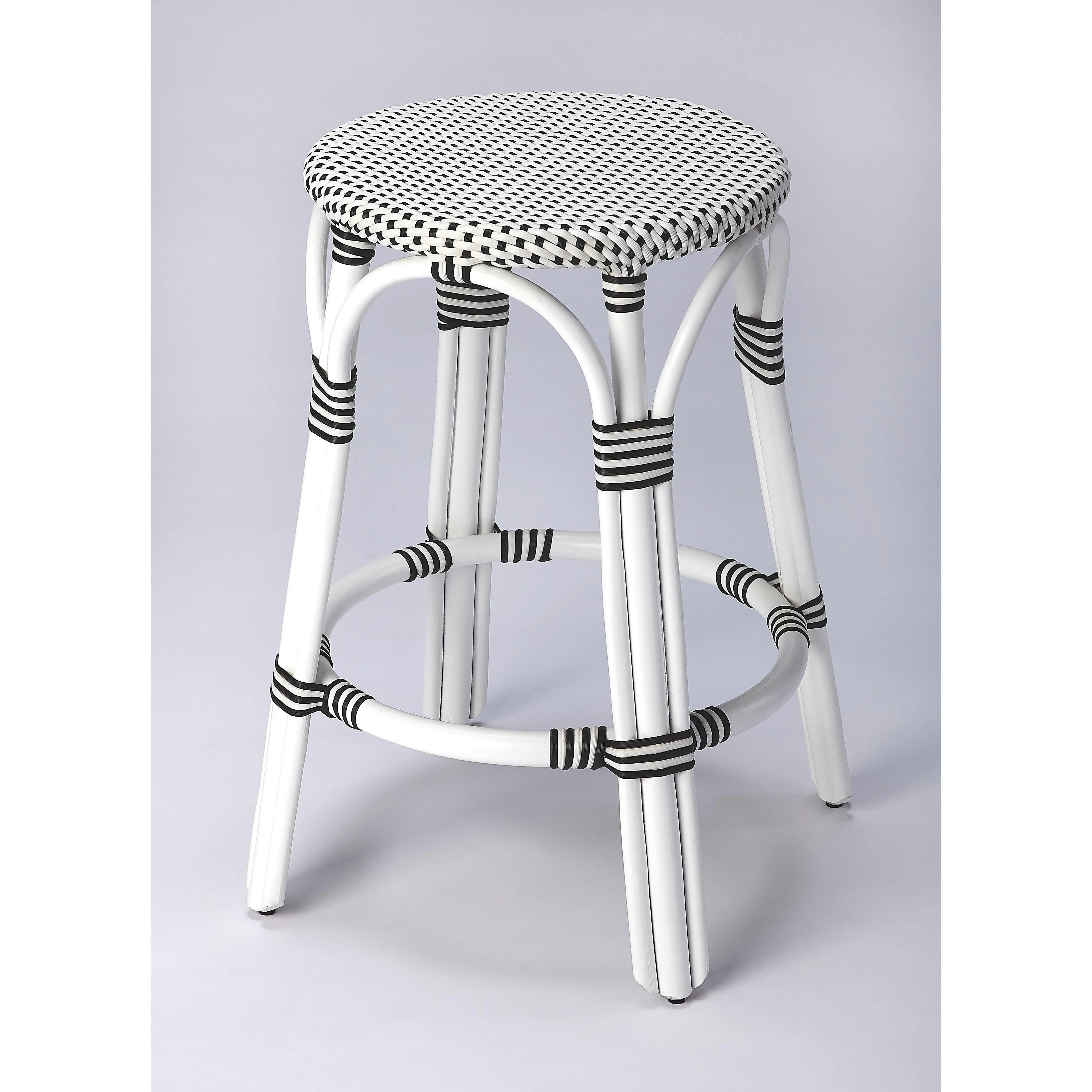 Butler Specialty Company Tobias 24 in. Seat Height Round Rattan Backless Counter Stool, White and Black Dot