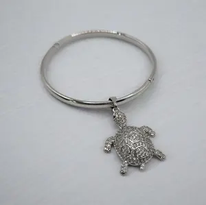 Silver-Plated Bangle With A Turtle Charm Filled With Zirconia