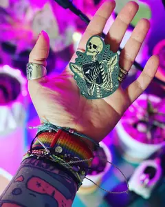 Approximately 3 inches Skeleton Reading Book vinyl sticker - retail swag