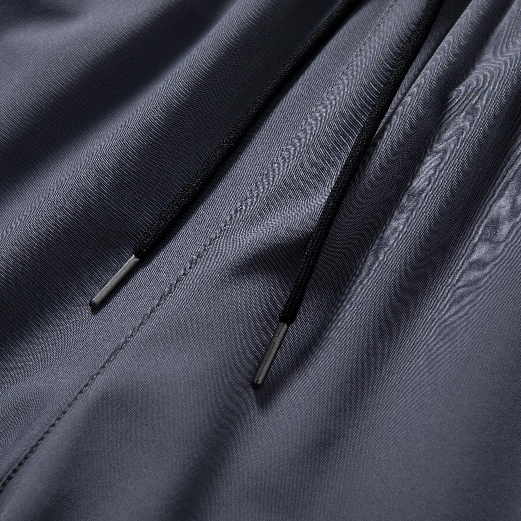 Men’s lightweight jogger pants with stretch fabric, 95% polyester, 5% spandex; elastic waistband with zippered pockets; breathable, quick-drying casual bottoms; men’s sports-casual jogger pants; machine washable.