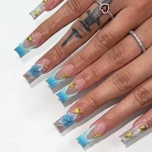 Elegant Blue and Gold Floral Nail Art Design for Women's Manicure