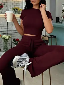 2pcs Women's Solid Color Slim Crop Top & Flare Pants Set  Breathable Stretch Jersey Material & Fitted Crop Tee & High-Waisted Drawstring Pants, Ideal for Fashion Girls in Coffee Runs/Errand Runs/Gym Sessions/Everyday Wear