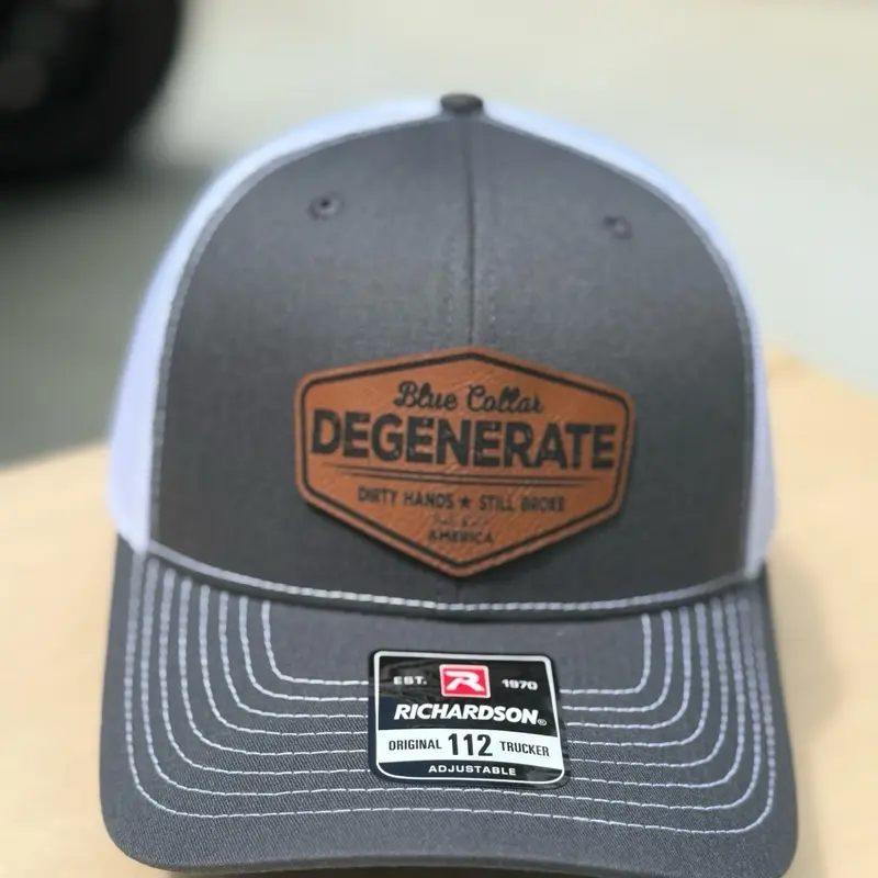 Blue collar degenerate, patch hat, dirty hands, still broke