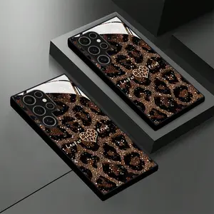 Brown heart-shaped leopard print phone case with white glossy glass. Compatible with Samsung S25, 24, 23, 22, 21, 20 FE/Plus/Ultra, A03S/05S/05/06/14/15/16/23/24/25/26/32/34/35/36/51/52/53/54/55/56/71, Note20, and other models.