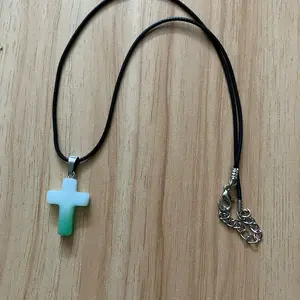 White and green acrylic cross necklace